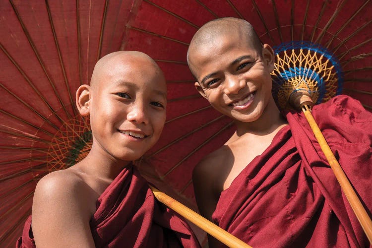 Two Young Buddhist Monks Smiling And Holding Red Umbrellas, Myanmar