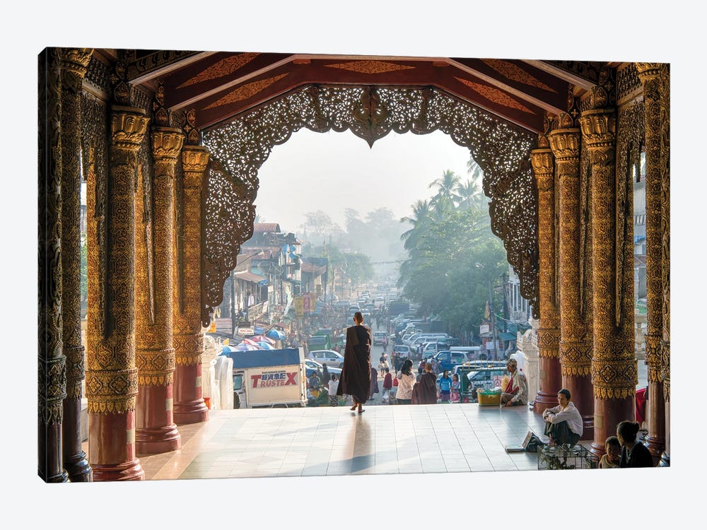 Buddhist Monk Passing The Entrance Of The Shwedagon Pagoda In Yangon, Myanmar by Jan Becke 1-piece Canvas Print