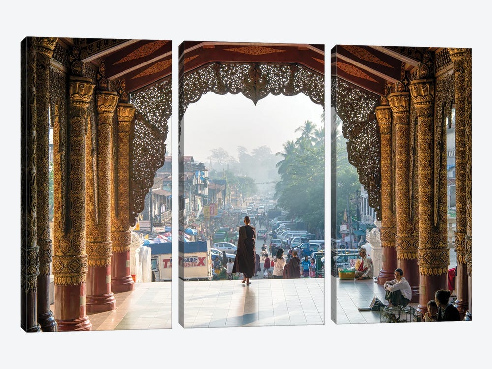 Buddhist Monk Passing The Entrance Of The Shwedagon Pagoda In Yangon, Myanmar by Jan Becke 3-piece Art Print