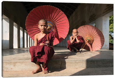Young Buddhist Monks With Red Umbrellas, Bagan, Myanmar Canvas Art Print - Old Bagan
