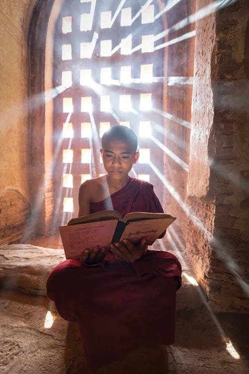 Burmese Novice Monk Reading A Book In A Temple, Bagan, Myanmar