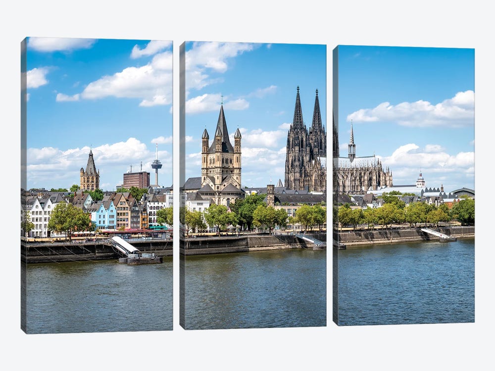 Cologne Skyline In Summer With View Of The Cologne Cathedral And Great St. Martin Church Along The Banks Of The Rhine River by Jan Becke 3-piece Canvas Print