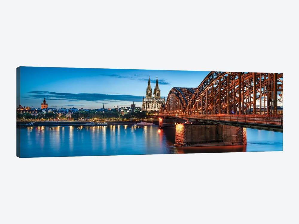 Panoramic View Of The Cologne Skyline With Cologne Cathedral And Hohenzollernbrücke At Night by Jan Becke 1-piece Canvas Wall Art