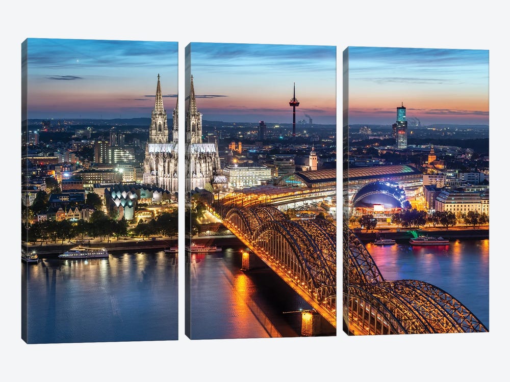 Aerial View Of Cologne With Cologne Cathedral And Hohenzollern Bridge At Dusk by Jan Becke 3-piece Canvas Art