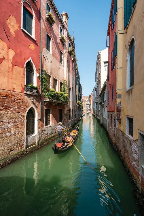 Gondola Ride Along A Small Canal In Venice, Italy