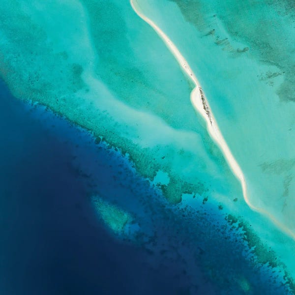 Aerial Beaches: Aerial View Of A Sandbank And Blue Lagoon In Maldives by Jan Becke