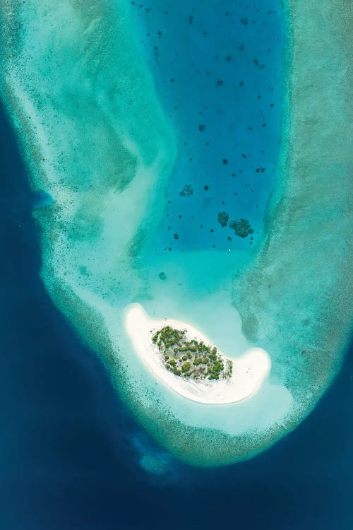 Aerial View Of A Small Tropical Island In Maldives