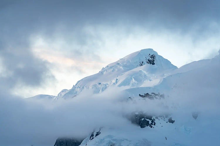 Icy Mountain Peak In Antarctica