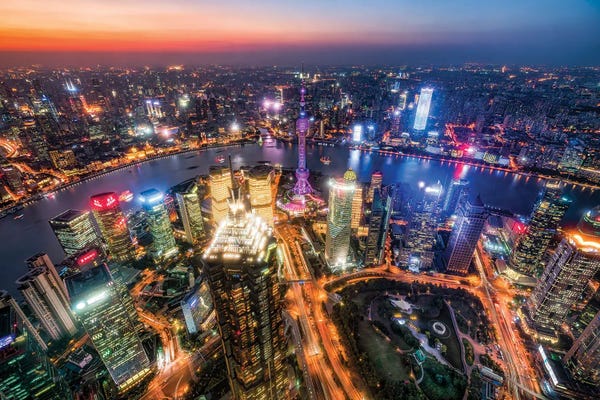 Aerial view of Pudong at night with Oriental Pearl Tower, Shanghai, China