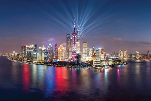 Shanghai: Pudong skyline lightshow, Shanghai, China by Jan Becke