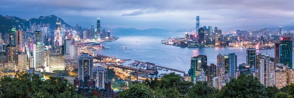 China: Hong Kong skyline panorama at night by Jan Becke