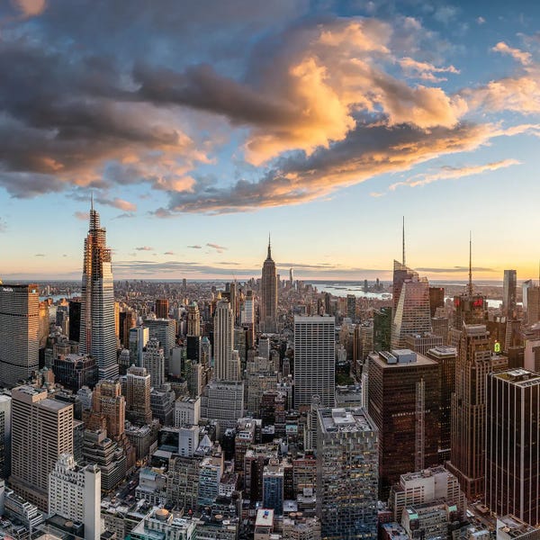 New York City Skylines: Manhattan skyline with Empire State Building at sunset by Jan Becke