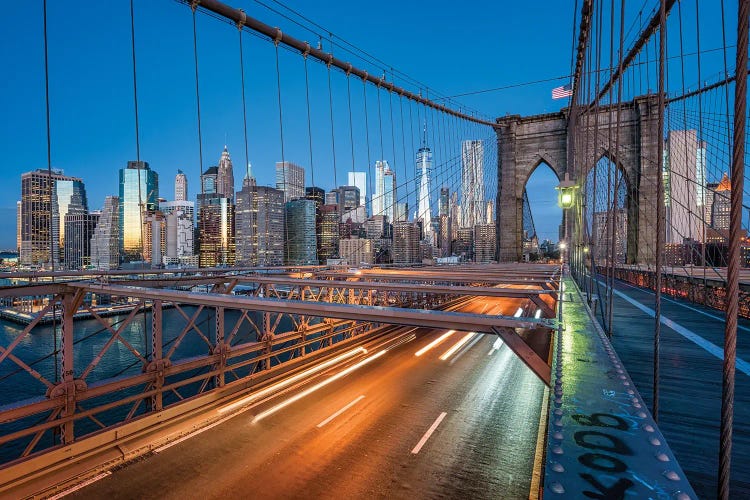 Brooklyn Bridge At Night With Manhattan Skyline In The Background