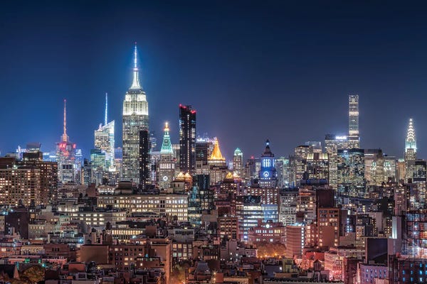 Manhattan: Midtown Manhattan Skyline With Empire State Building At Night by Jan Becke