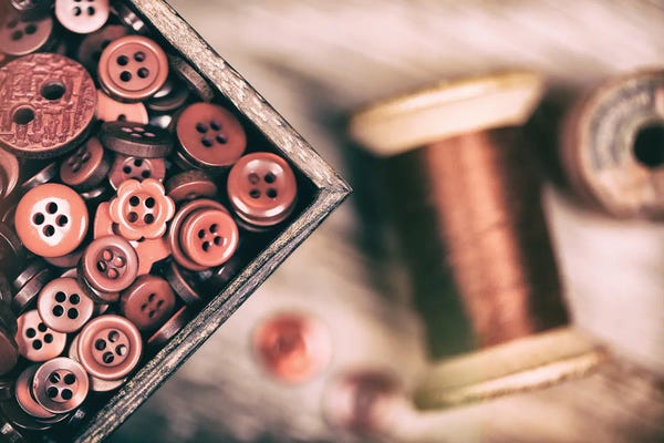 Still Life Photography: Needlework Background Of Buttons And Thread by Jane Rix