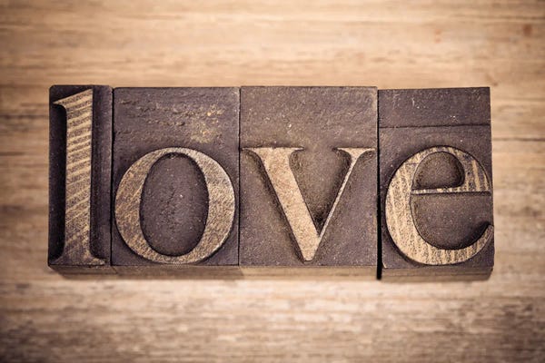 Still Life Photography: Printing Blocks Spelling Love by Jane Rix