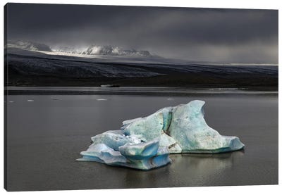 Iceberg Against Stormy Skies And Sunlight Canvas Art Print - Glacier & Iceberg Art