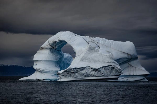 Glaciers & Icebergs: Arch Iceberg With Dramatic Sky by Jane Rix