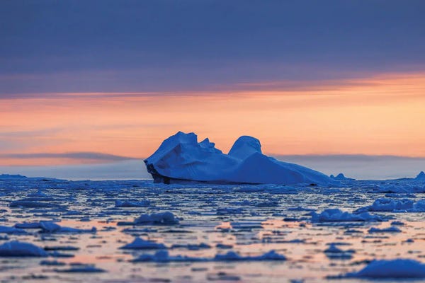 Blue Iceberg At Dawn In Scoresby Sund, Greenland