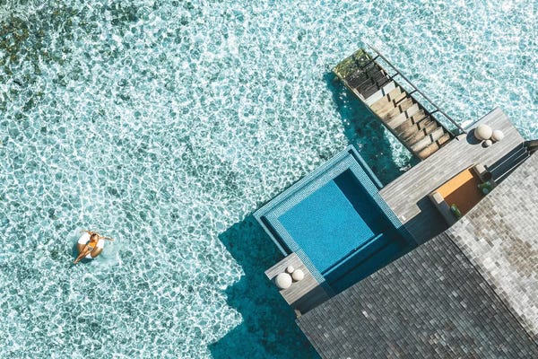 James Vodicka: Maldives Resort Bungalows Girl Pool Ring Aerial by James Vodicka