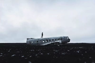 Man Walking Plane Wreck by James Vodicka art print