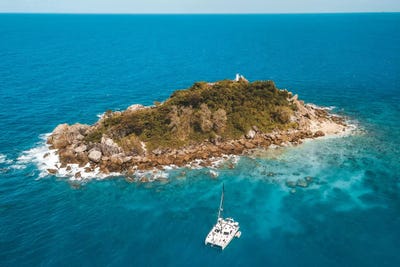 Tiny Island with Catamaran by James Vodicka art print