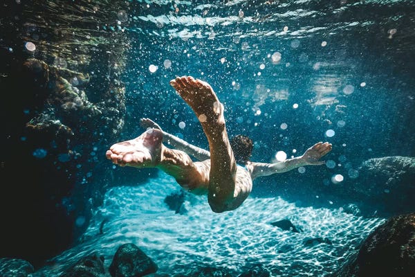 Calm Beneath The Surface: Fairy Pools Swimmer Underwater by James Vodicka