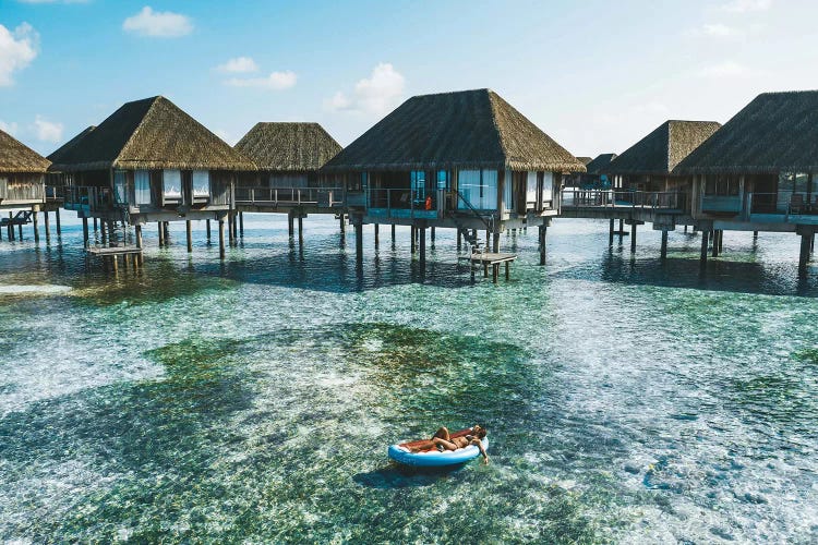 Maldives Resort Bungalows Girl Pool Float by James Vodicka wall art
