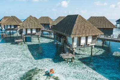 Maldives Resort Bungalows Girl Pool Float 2 by James Vodicka framed wall art