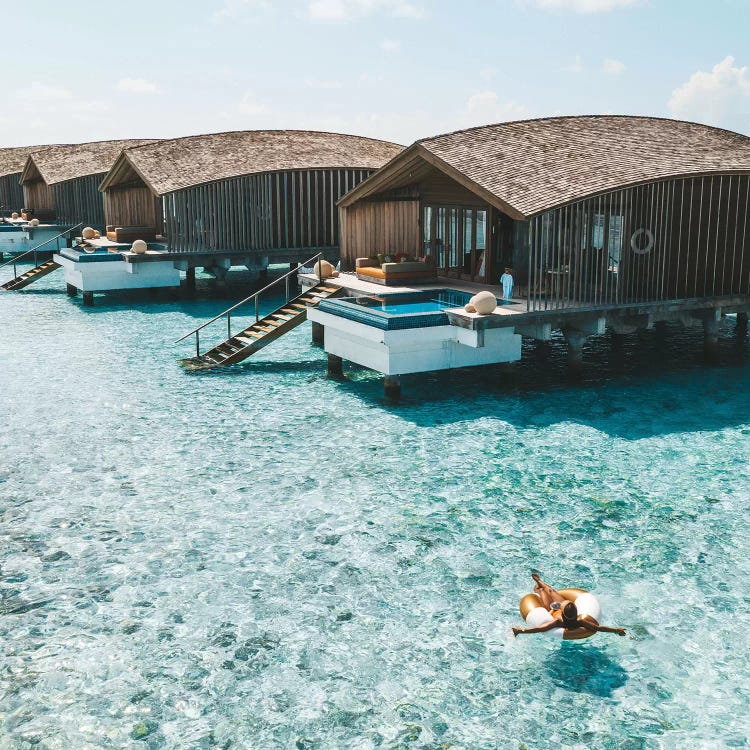 Maldives Resort Bungalows Girl Pool Ring by James Vodicka wall art