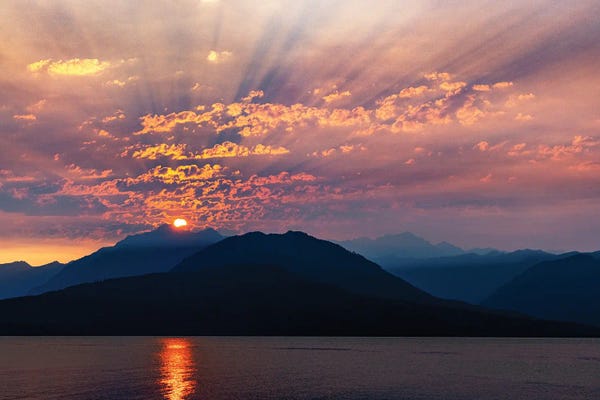 USA, Washington State, Seabeck. Smoky Sunset Over Hood Canal And Olympic Mountains.
