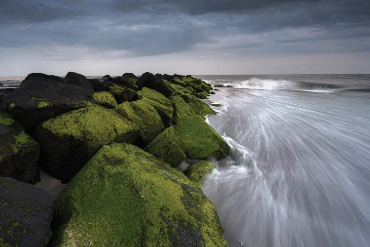 USA, New Jersey, Cape May National Seashore. Sunset On Ocean And Mossy Beach Rocks.