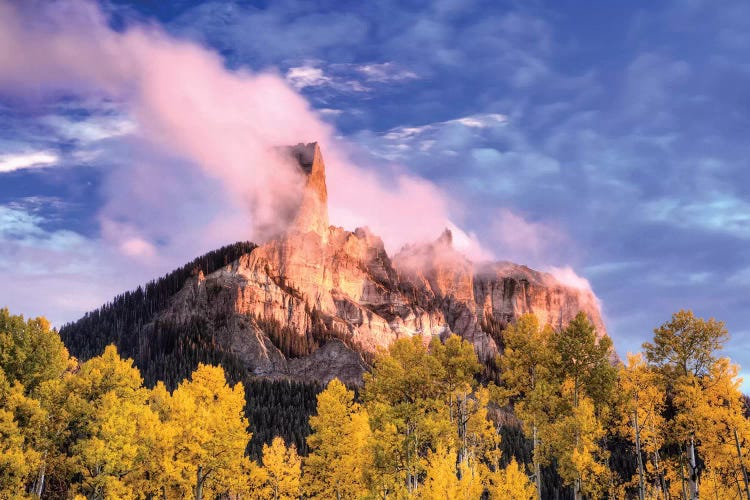 USA, Colorado, San Juan Mountains. Autumn aspen trees and Chimney Rock.