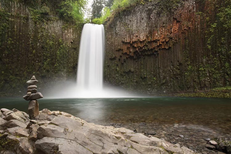 USA, Oregon. Abiqua Falls and stacked pile of rocks.