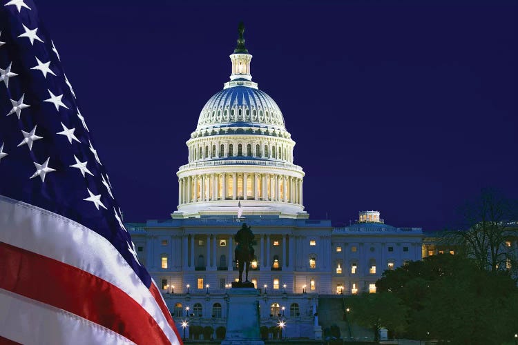 USA, Washington DC. Capitol Building and US flag at night.