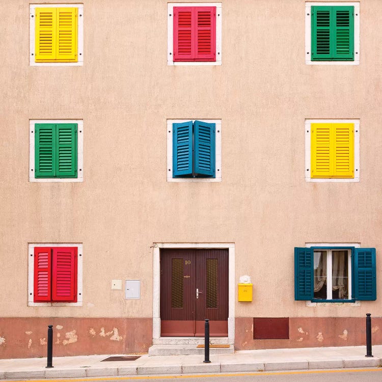 Croatia, Vrsar. Building with colorful shutters. 