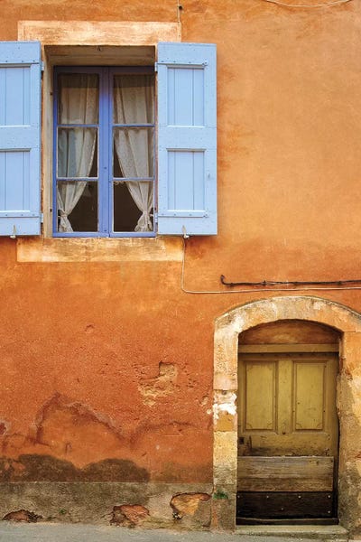 France, Provence, Roussillon. Weathered window and door of house.