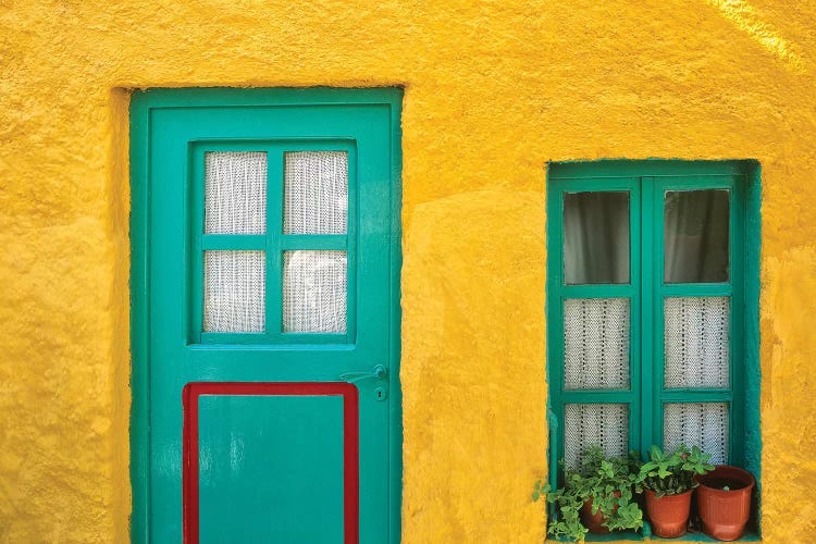 Greece, Nissyros. Door and window of colorful house. 