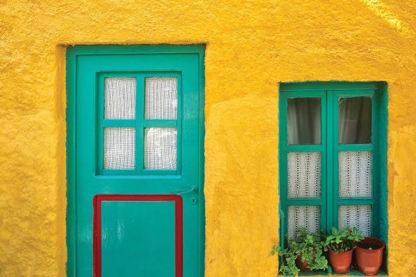Greece, Nissyros. Door and window of colorful house.