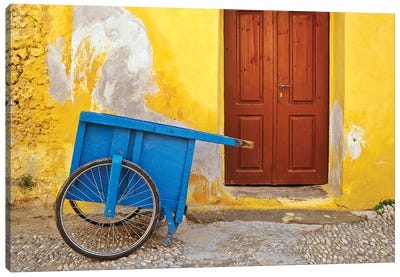 Greece, Rhodes. House with blue cart in front.  Canvas Art Print - Door Art