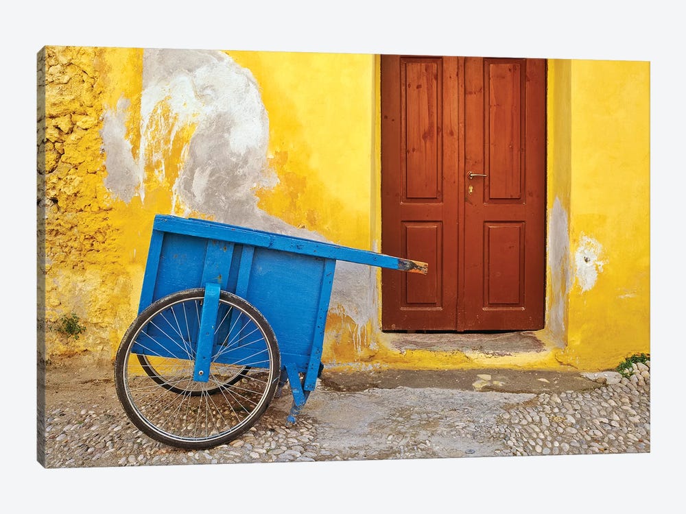 Greece, Rhodes. House with blue cart in front.  by Jaynes Gallery 1-piece Art Print