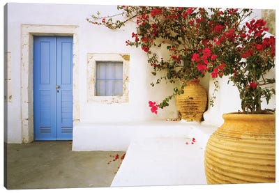 Greece, Santorini. Blue door to house and potted flowers.  Canvas Art Print - Door Art