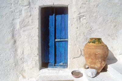 Greece, Symi. Blue door and pot.  by Jaynes Gallery canvas print