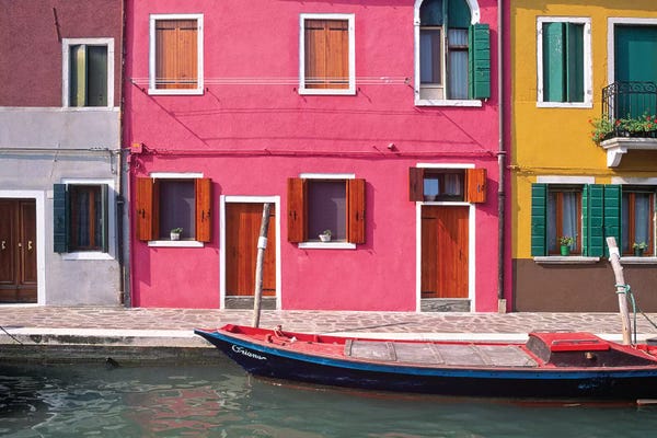 Burano: Italy, Burano. Colorful house exteriors and boat in canal.  by Jaynes Gallery