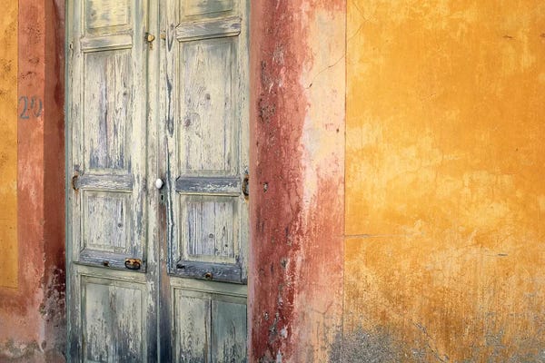 Italy, Lipari. Weathered wall and door.