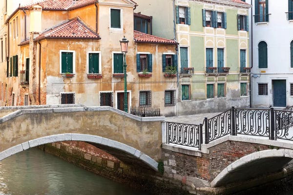 Italy, Venice. Canal bridge and buildings.