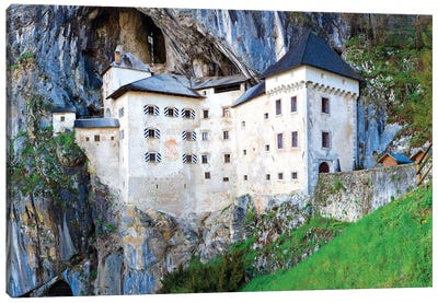 Slovenia, Predjama Castle. Castle built into mountain wall.  Canvas Art Print - Castle & Palace Art