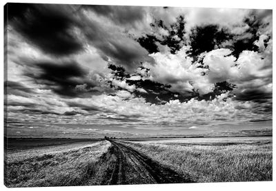 Canada, Manitoba, Grande Pointe. Black and white of clouds and road through field. Canvas Art Print