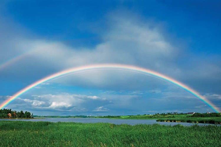 Canada, Quebec, St. Gedeon. Rainbow after storm.