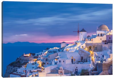 Greece, Oia. Greek Orthodox church and village at sunset.  Canvas Art Print - Churches & Places of Worship